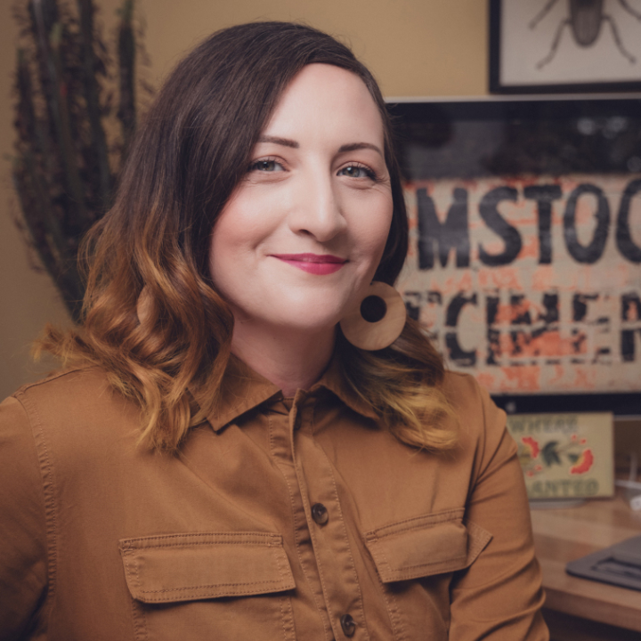 Christine sitting at her desk